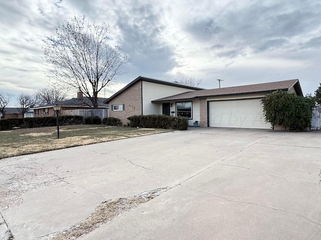 view of front of house with a garage and a front lawn