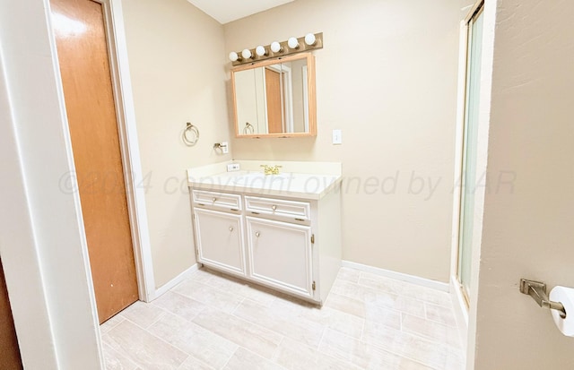 bathroom with a shower and vanity