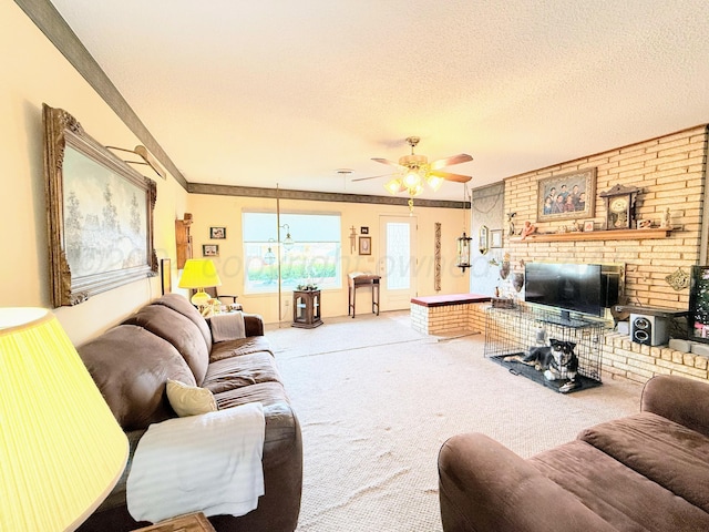 living room featuring carpet, ceiling fan, and a textured ceiling