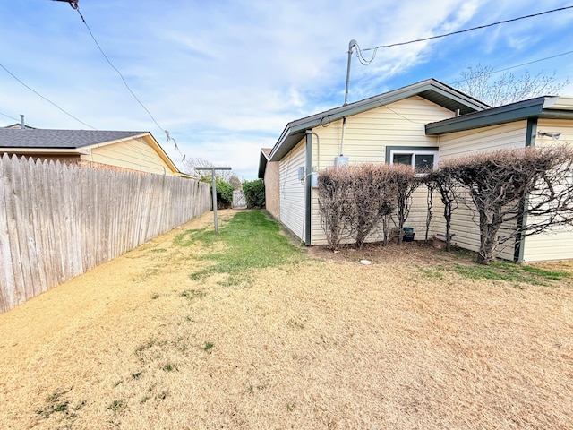 view of home's exterior with a yard