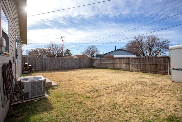 view of yard with central AC