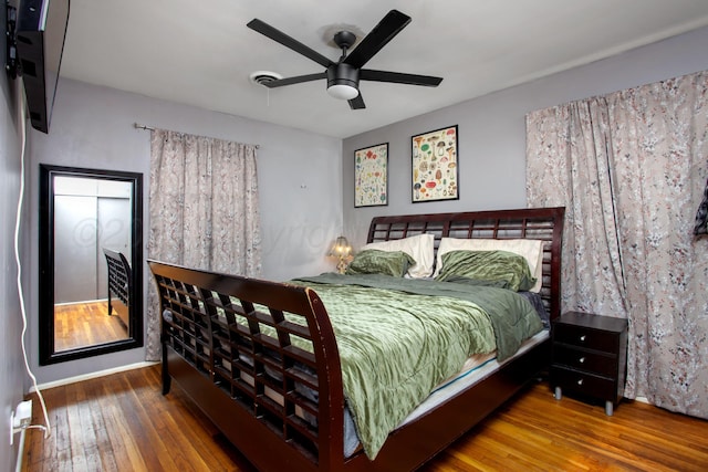 bedroom featuring ceiling fan and wood-type flooring