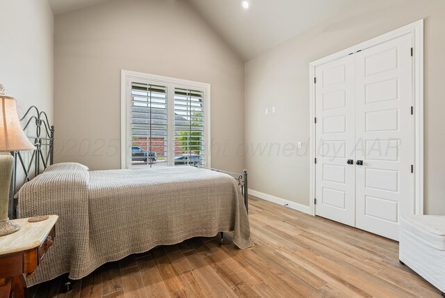 5504 Wesley Dr, Amarillo, TX 79119 - bedroom with light wood-style floors, a closet, high vaulted ceiling, and recessed lighting