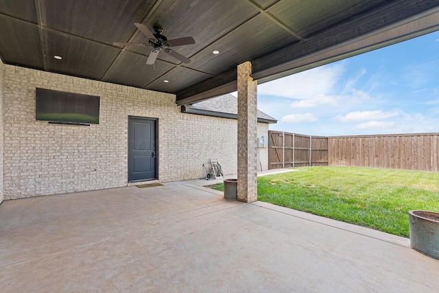 5504 Wesley Dr, Amarillo, TX 79119 - fenced backyard with a ceiling fan and a patio