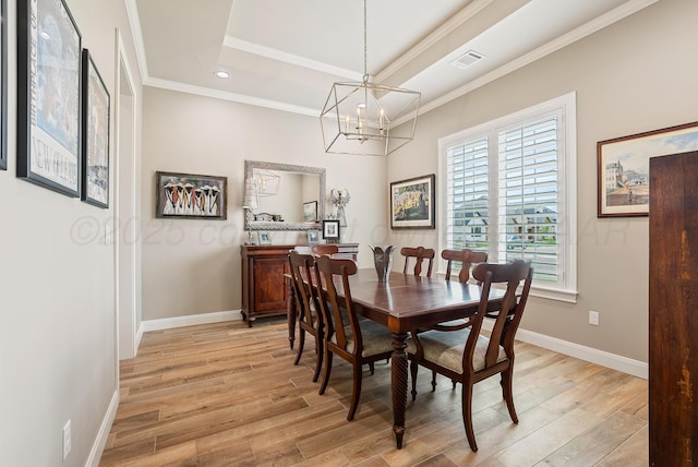 5504 Wesley Dr, Amarillo, TX 79119 - dining room featuring light wood-style flooring, crown molding, a tray ceiling, a chandelier, and recessed lighting