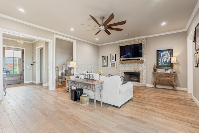 5504 Wesley Dr, Amarillo, TX 79119 - living area featuring ceiling fan, light wood-style floors, stairway, a fireplace, and recessed lighting