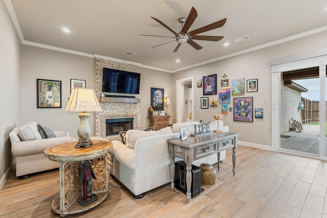 5504 Wesley Dr, Amarillo, TX 79119 - living room with ceiling fan, light wood-style flooring, a fireplace, ornamental molding, and recessed lighting
