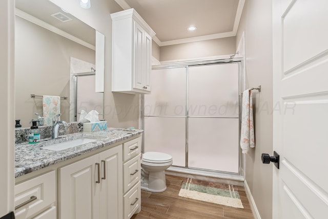 5504 Wesley Dr, Amarillo, TX 79119 - bathroom featuring vanity, a shower stall, ornamental molding, and wood finished floors