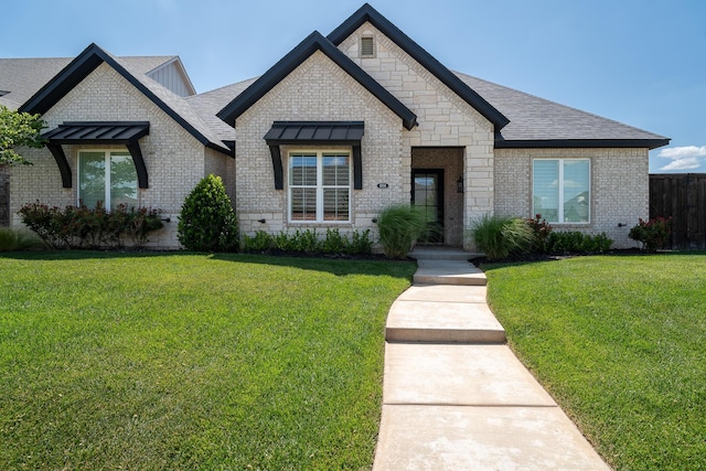 5504 Wesley Dr, Amarillo, TX 79119 - french country home with brick siding and a shingled roof