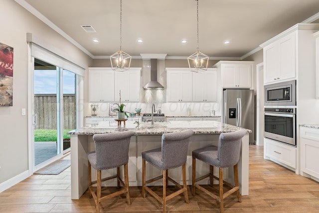 5504 Wesley Dr, Amarillo, TX 79119 - kitchen featuring stainless steel appliances, wall chimney exhaust hood, crown molding, decorative backsplash, and recessed lighting