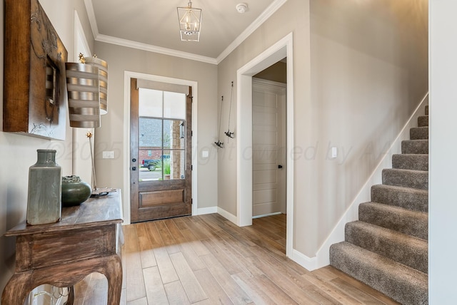 5504 Wesley Dr, Amarillo, TX 79119 - entrance foyer with stairs, light wood-style floors, crown molding, and a chandelier
