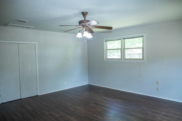 301 Maple Ave, Panhandle, TX 79068 - spare room with dark wood-type flooring and a ceiling fan