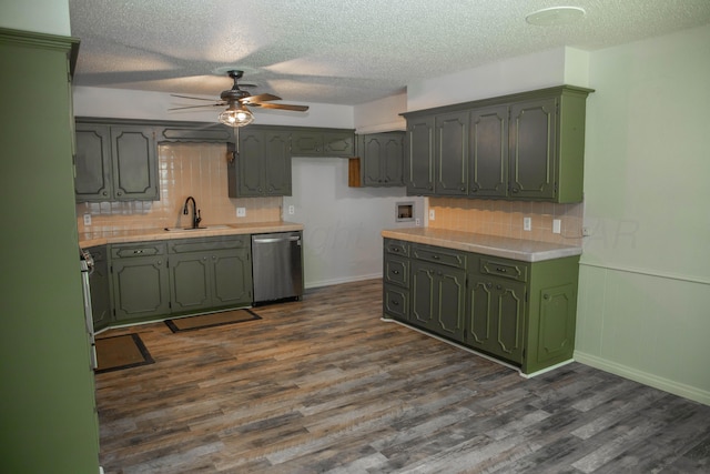 301 Maple Ave, Panhandle, TX 79068 - kitchen featuring green cabinets, stainless steel dishwasher, a ceiling fan, dark wood-style flooring, and a textured ceiling