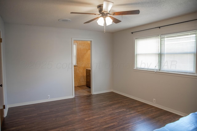 301 Maple Ave, Panhandle, TX 79068 - unfurnished bedroom with wood finished floors, a textured ceiling, and ceiling fan