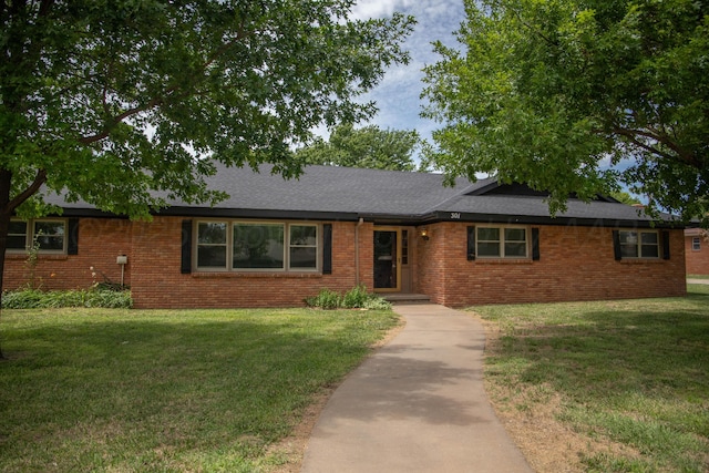 301 Maple Ave, Panhandle, TX 79068 - ranch-style house with a front lawn, brick siding, and roof with shingles