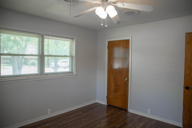 301 Maple Ave, Panhandle, TX 79068 - unfurnished room with ceiling fan and dark wood-style flooring