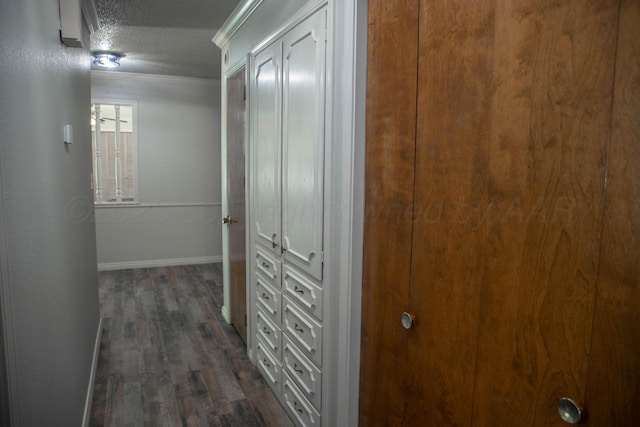 301 Maple Ave, Panhandle, TX 79068 - hallway with dark wood-type flooring, a textured ceiling, and ornamental molding