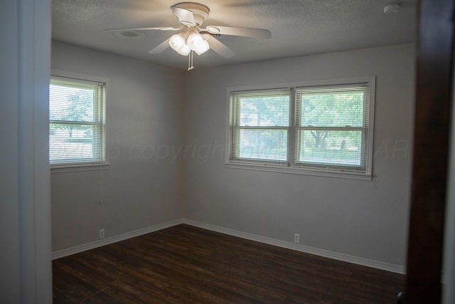 301 Maple Ave, Panhandle, TX 79068 - spare room featuring dark wood finished floors, a smoke detector, ceiling fan, and a textured ceiling