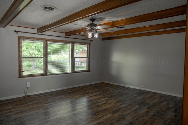 301 Maple Ave, Panhandle, TX 79068 - unfurnished room with plenty of natural light, beamed ceiling, ceiling fan, a textured ceiling, and dark wood finished floors