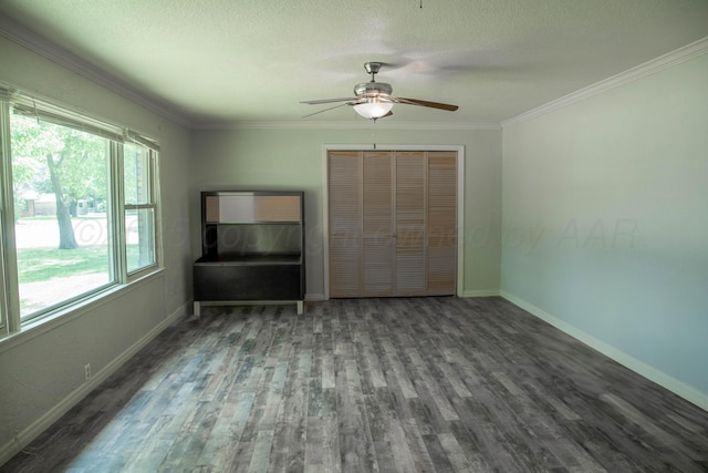 301 Maple Ave, Panhandle, TX 79068 - unfurnished bedroom with wood finished floors, ornamental molding, a closet, a textured ceiling, and ceiling fan