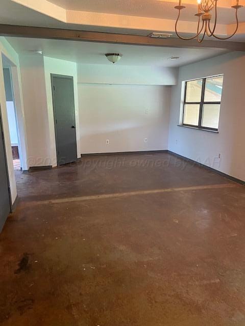 235 Cliffside Dr, Amarillo, TX 79118 - empty room with a chandelier