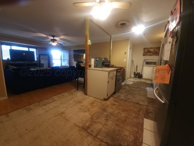 2706 Magnolia St, Amarillo, TX 79107 - kitchen with freestanding refrigerator, ceiling fan, stainless steel range with electric stovetop, and light countertops