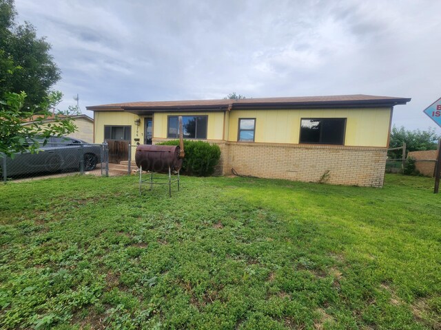 2706 Magnolia St, Amarillo, TX 79107 - back of house featuring brick siding and oil tank