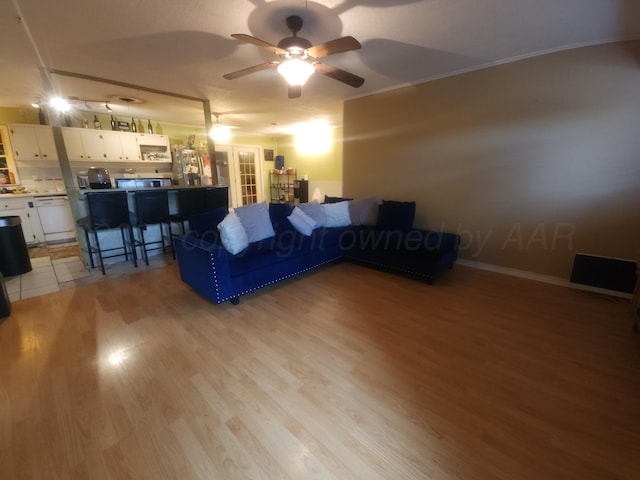 2706 Magnolia St, Amarillo, TX 79107 - living area featuring french doors, ceiling fan, light wood-style flooring, and crown molding
