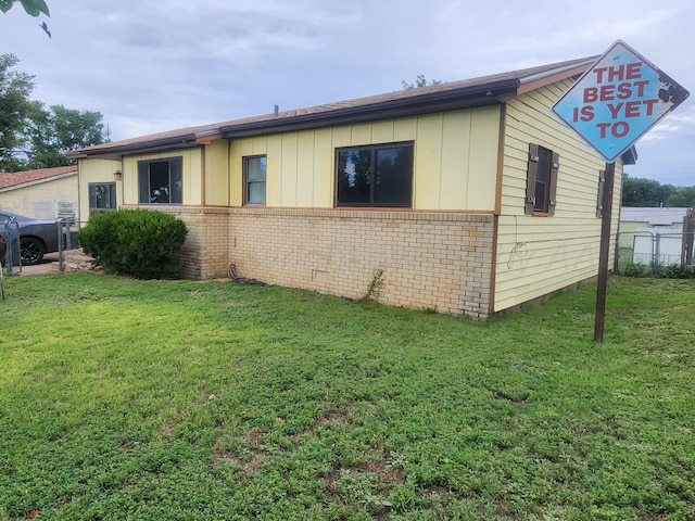 2706 Magnolia St, Amarillo, TX 79107 - view of side of property with brick siding and board and batten siding