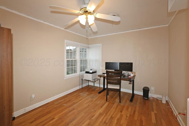 office space featuring a ceiling fan, ornamental molding, baseboards, and wood finished floors