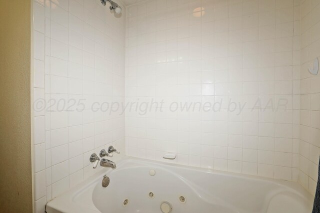 bathroom with a jetted tub