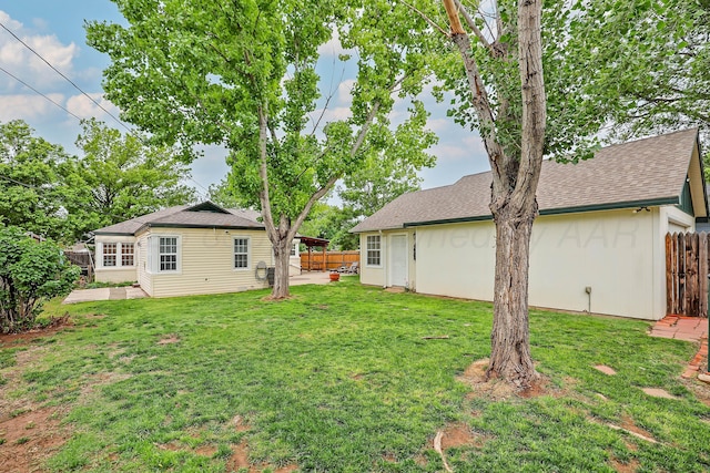 view of yard with fence and a patio