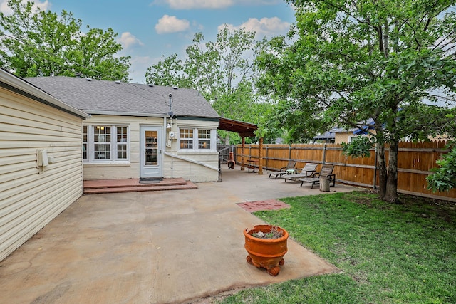 view of patio featuring fence