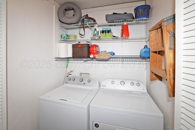 laundry room featuring washing machine and clothes dryer
