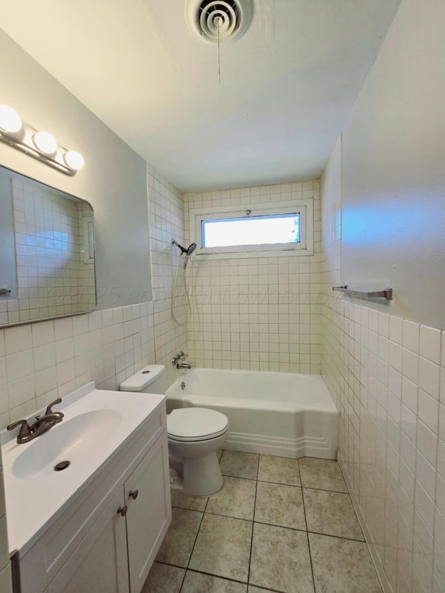 4301 S Washington St, Amarillo, TX 79110 - full bathroom featuring tile walls, vanity, tile patterned floors, and tub / shower combination