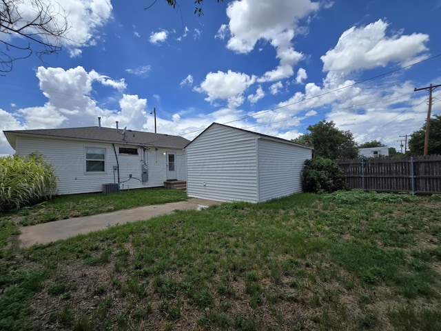 4301 S Washington St, Amarillo, TX 79110 - back of property with entry steps and an outdoor structure