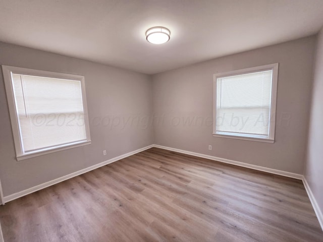 4301 S Washington St, Amarillo, TX 79110 - empty room featuring baseboards and wood finished floors