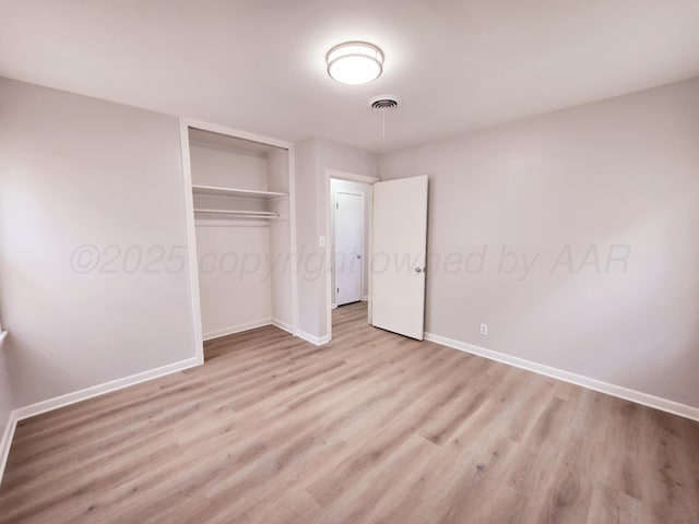 4301 S Washington St, Amarillo, TX 79110 - unfurnished bedroom featuring light wood-style flooring and a closet