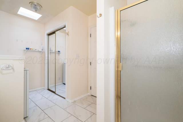 3519 S Julian Blvd, Amarillo, TX 79102 - hallway with marble finish floor and a skylight