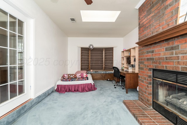 3519 S Julian Blvd, Amarillo, TX 79102 - office featuring visible vents, a brick fireplace, baseboards, carpet, and a skylight