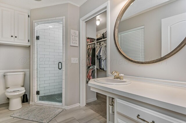 7703 Farrell Dr, Amarillo, TX 79121 - full bath featuring a shower stall, a spacious closet, and vanity
