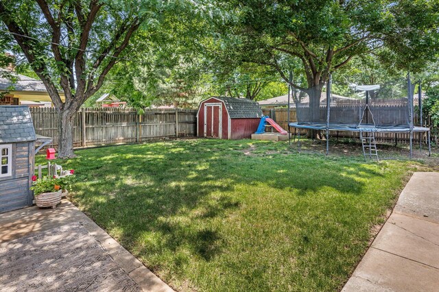7703 Farrell Dr, Amarillo, TX 79121 - fenced backyard with a trampoline and a storage shed