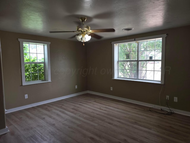1313 Skyline Dr, Amarillo, TX 79108 - spare room featuring wood finished floors, a ceiling fan, and baseboards