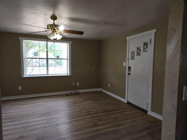 1313 Skyline Dr, Amarillo, TX 79108 - unfurnished room with wood finished floors, baseboards, and ceiling fan