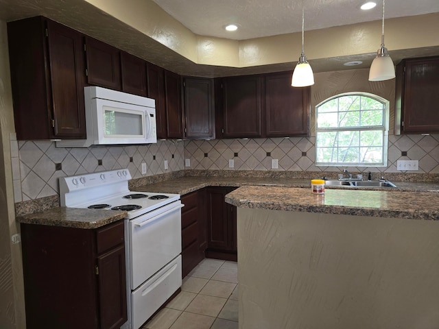 1313 Skyline Dr, Amarillo, TX 79108 - kitchen with white appliances, a sink, tasteful backsplash, light tile patterned flooring, and dark brown cabinetry