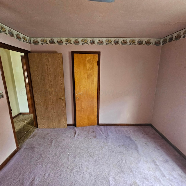 1206 Durrett Ave, Dumas, TX 79029 - unfurnished bedroom with carpet floors and baseboards