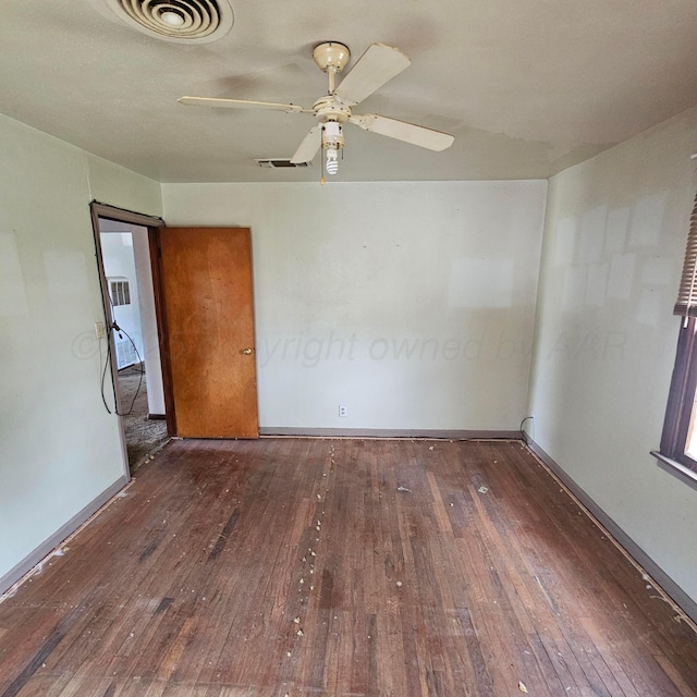 1206 Durrett Ave, Dumas, TX 79029 - unfurnished room featuring hardwood / wood-style flooring and a ceiling fan