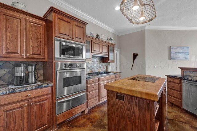 6414 Persimmon Ln, Amarillo, TX 79124 - kitchen featuring stainless steel appliances, a warming drawer, wood counters, decorative backsplash, and concrete flooring
