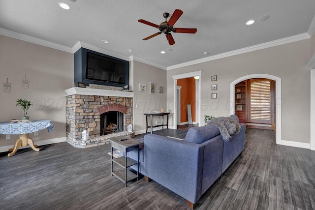 6414 Persimmon Ln, Amarillo, TX 79124 - living area with ceiling fan, baseboards, wood finished floors, a stone fireplace, and ornamental molding