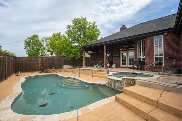 6414 Persimmon Ln, Amarillo, TX 79124 - view of swimming pool with french doors, an in-ground hot tub, a fenced backyard, and a patio